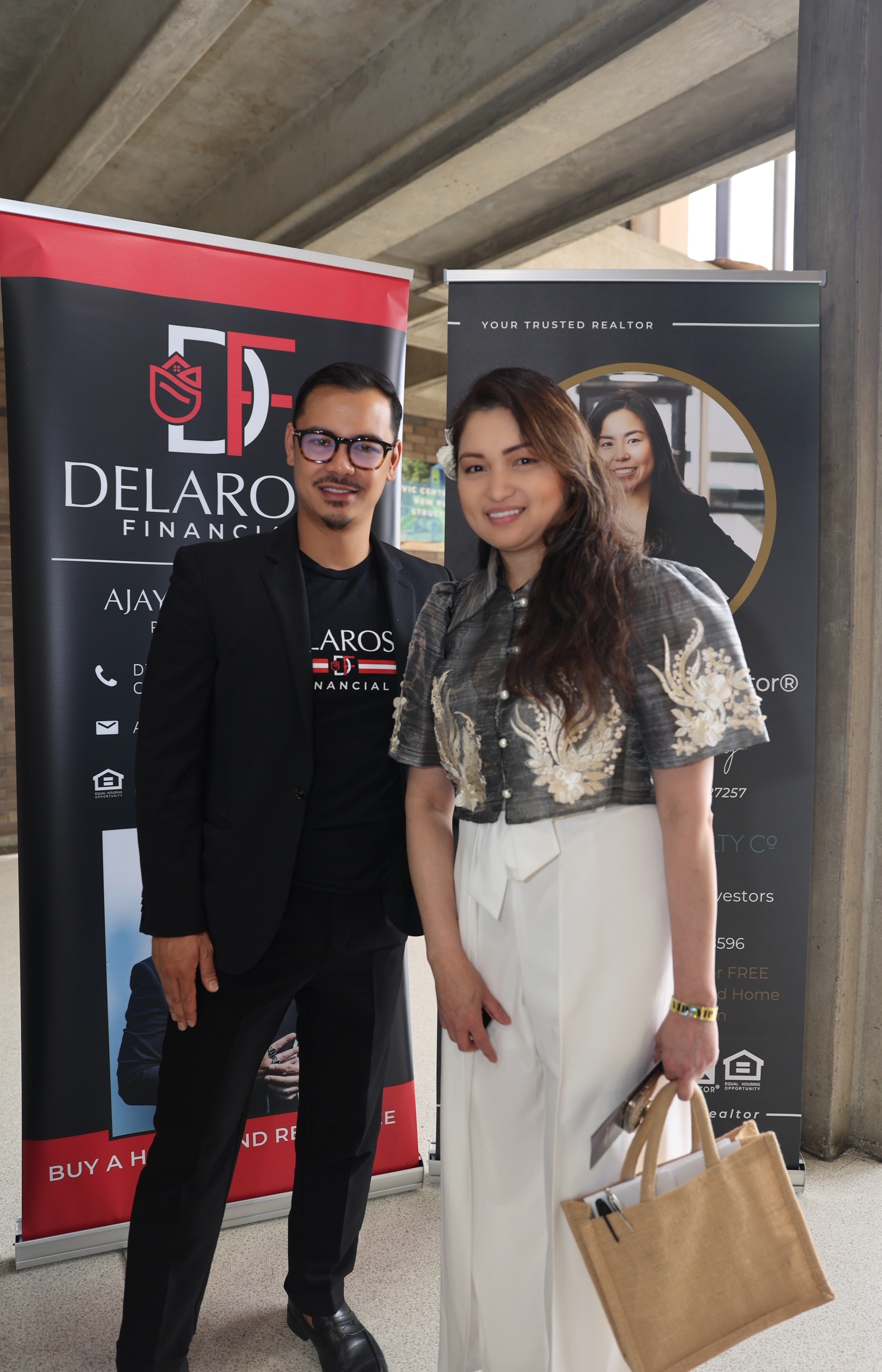 Ajay Delarosa at a Filipino community real estate event with Delarosa Financial branding